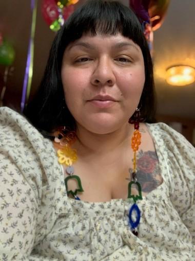 Selfie of an Indigenous woman wearing a colourful necklace