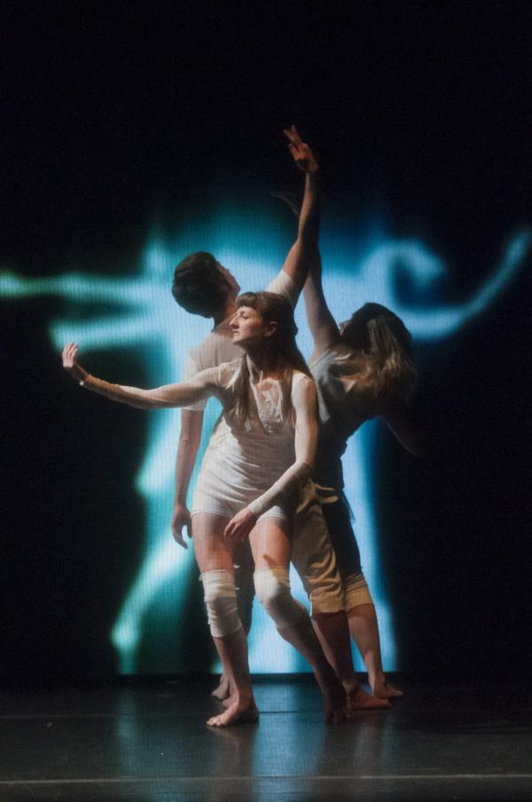 dancers in ghostly projections