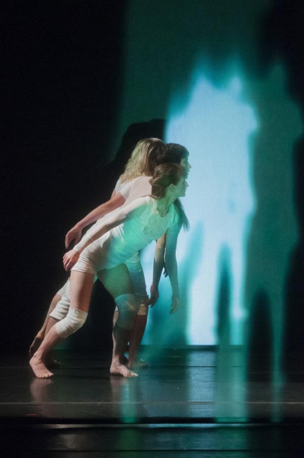 dancers in ghostly projections