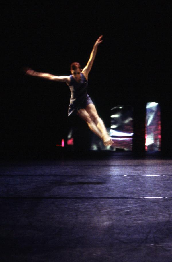 A dancer jumps in the air. 