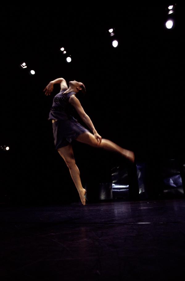 A dancer jumps in the air. 