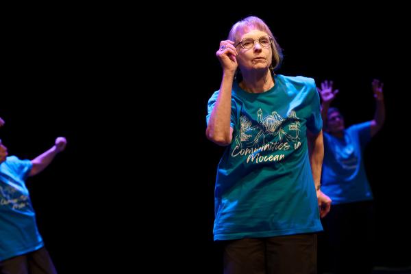 Seniors dancing in blue t-shirts