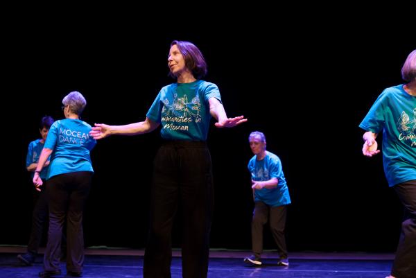 Seniors dancing in blue t-shirts