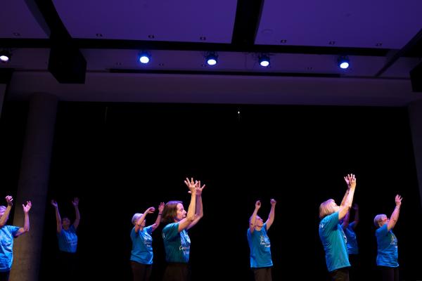 a group of seniors in blue tshirts