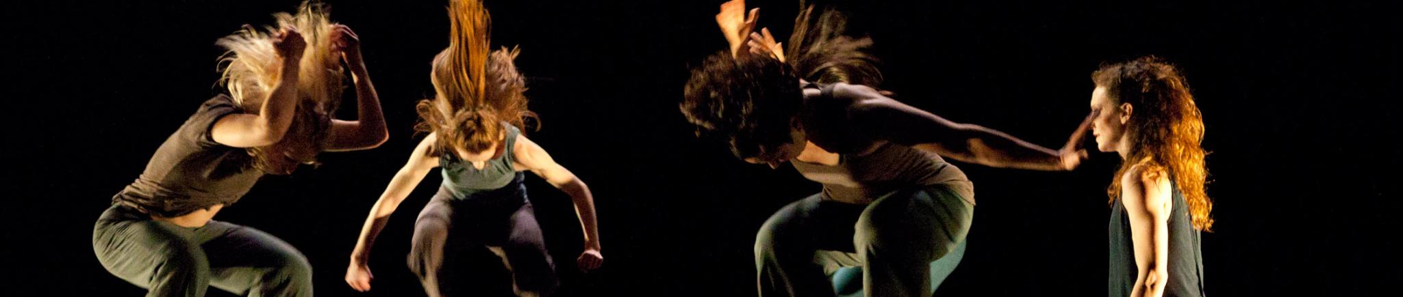 Four dancers in full jump and one dancer walking