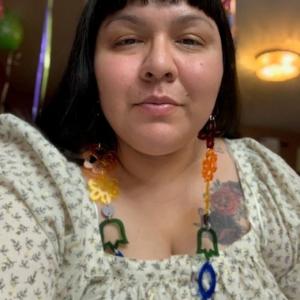 Selfie of an Indigenous woman wearing a colourful necklace